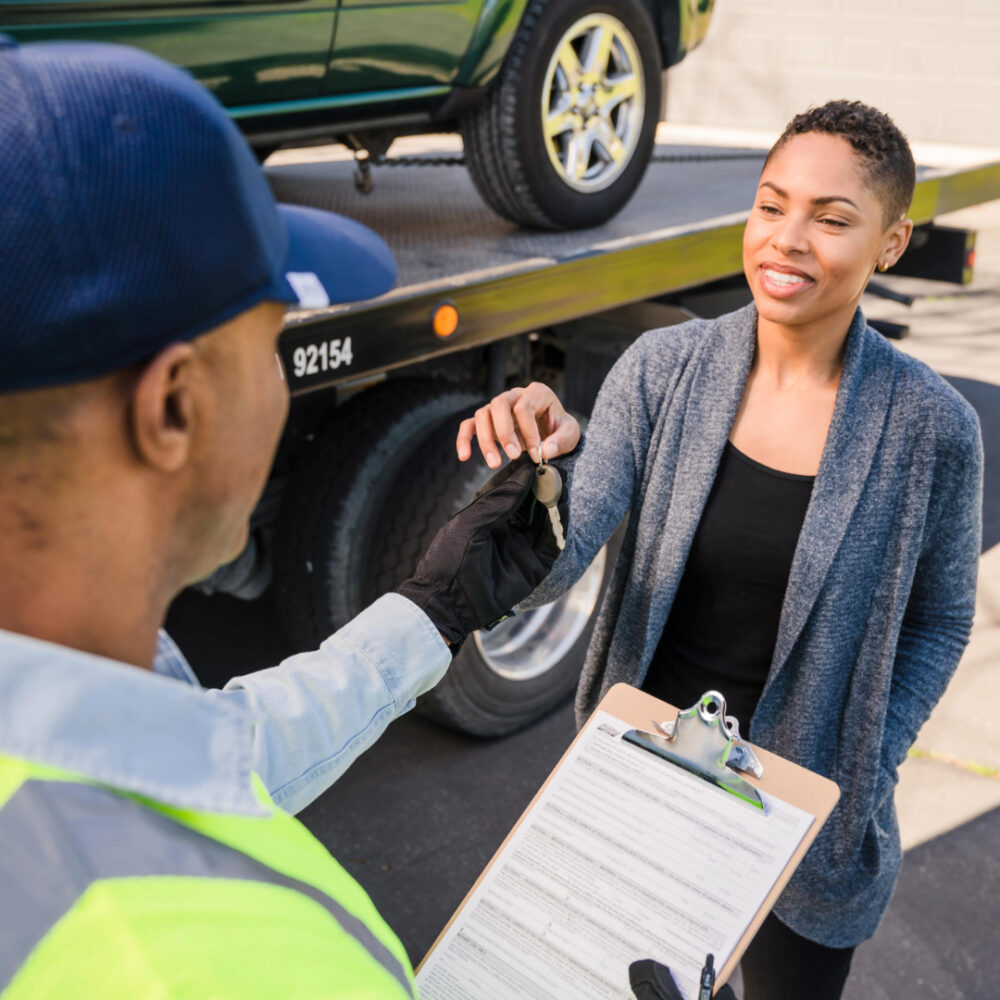 Handing car keys to a donated car