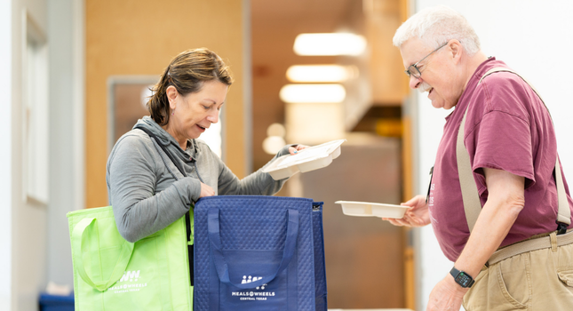Woman picking up meals to be delivered